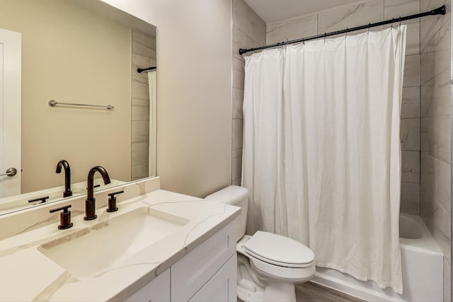 full bathroom with toilet, shower / bath combo, and vanity