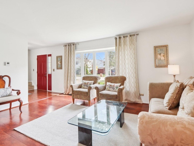 living room with baseboards and wood finished floors