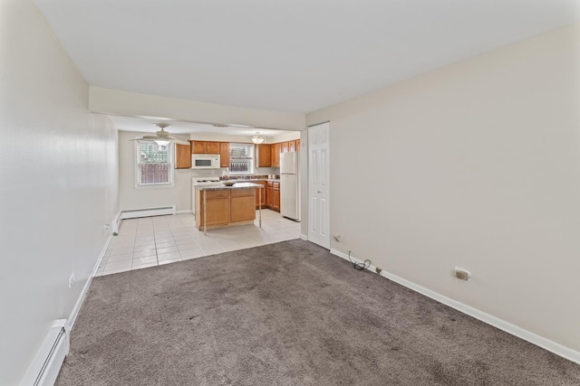 2336 Union St Unit 3, Blue Island, IL 60406 - unfurnished living room featuring baseboard heating, baseboards, and light colored carpet