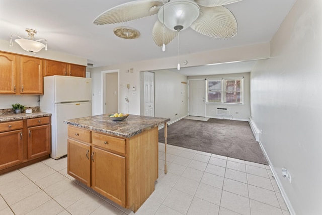 2336 Union St Unit 3, Blue Island, IL 60406 - kitchen featuring light tile patterned flooring, a kitchen island, baseboards, freestanding refrigerator, and open floor plan