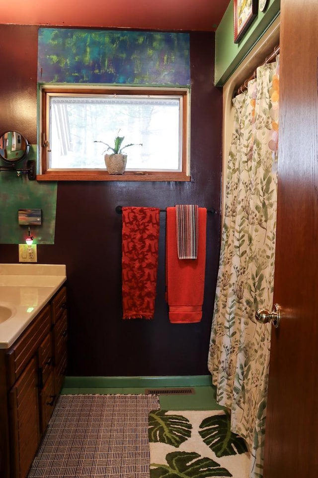 full bathroom with vanity and a shower with shower curtain