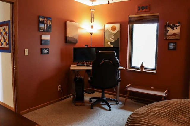 carpeted office featuring baseboards