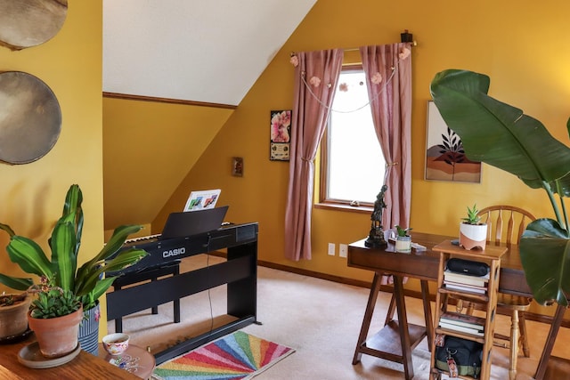 carpeted office featuring baseboards and vaulted ceiling
