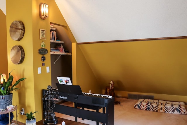 bedroom featuring carpet, vaulted ceiling, and visible vents