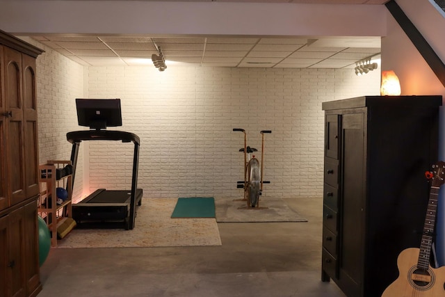 workout room with brick wall
