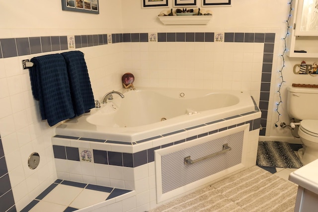 bathroom with toilet, tile patterned floors, and a jetted tub