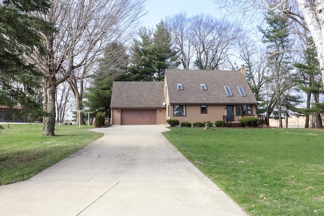 cape cod home with a shingled roof, a garage, a chimney, concrete driveway, and a front lawn
