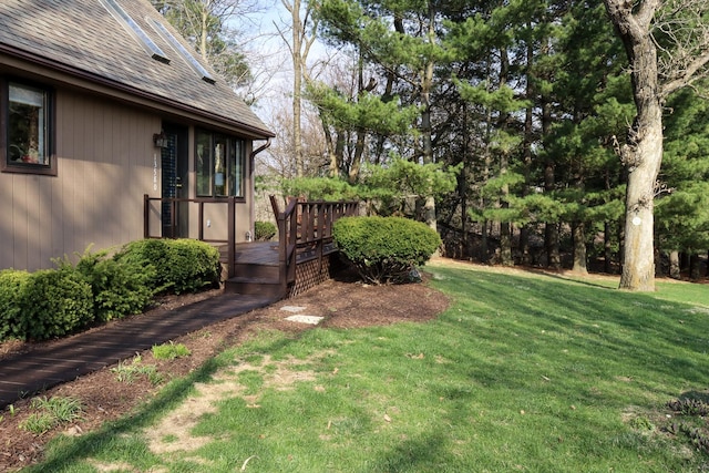 view of yard with a wooden deck