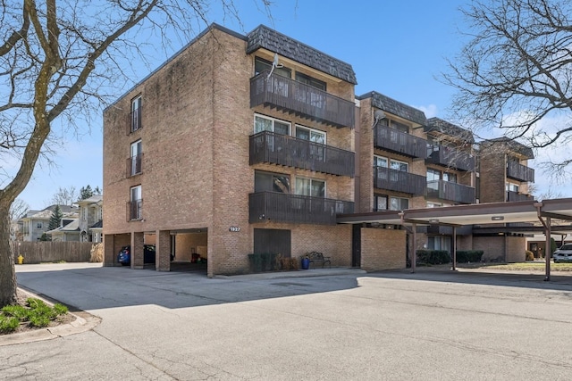 1927 Tanglewood Dr Unit 4A, Glenview, IL 60025 - view of building exterior with covered parking