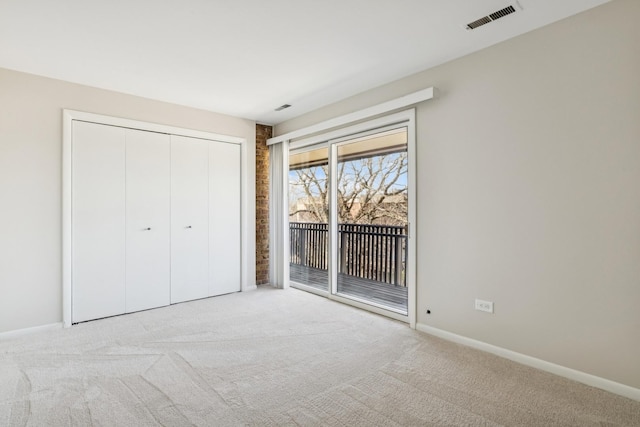 1927 Tanglewood Dr Unit 4A, Glenview, IL 60025 - unfurnished bedroom with visible vents, baseboards, access to outside, and carpet floors