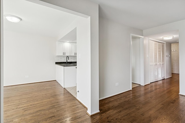 1927 Tanglewood Dr Unit 4A, Glenview, IL 60025 - hall with baseboards, wood finished floors, and a sink