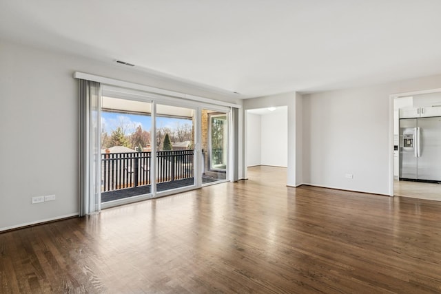 1927 Tanglewood Dr Unit 4A, Glenview, IL 60025 - spare room featuring wood finished floors and visible vents