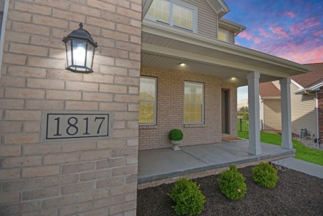exterior space featuring brick siding