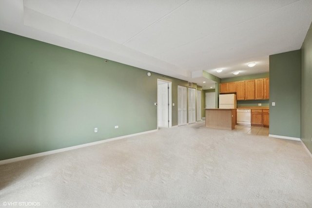 2335 W Belle Plaine Ave Unit 207, Chicago, IL 60618 - unfurnished living room with baseboards and light carpet