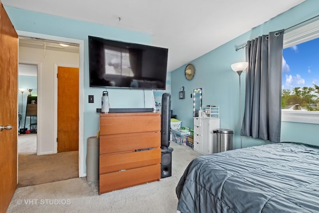 carpeted bedroom with attic access