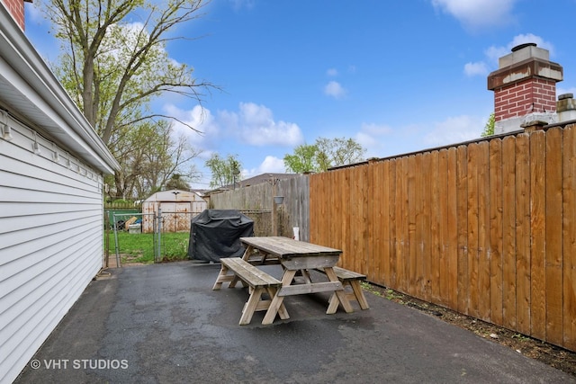 view of patio / terrace with outdoor dining area, fence, and grilling area