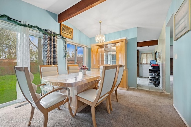 dining area with carpet floors, visible vents, an inviting chandelier, beam ceiling, and baseboards