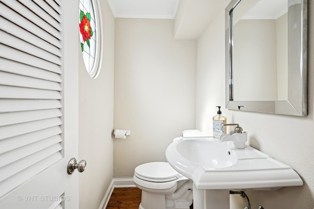 209 W Lake St, Barrington, IL 60010 - bathroom featuring baseboards, wood finished floors, toilet, and ornamental molding