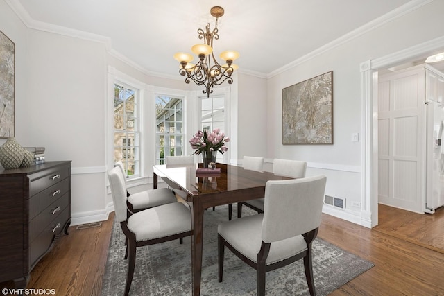 209 W Lake St, Barrington, IL 60010 - dining space with dark wood-style floors, a chandelier, baseboards, and crown molding