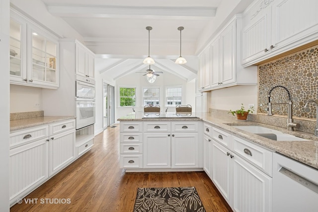 209 W Lake St, Barrington, IL 60010 - kitchen featuring dishwasher, beamed ceiling, a peninsula, a sink, and white cabinetry