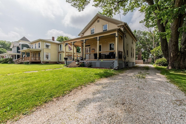 112 E Peru St, Princeton, IL 61356 - view of front of property featuring a porch, a front lawn, and gravel driveway