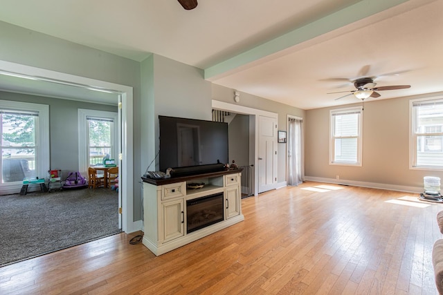 112 E Peru St, Princeton, IL 61356 - unfurnished living room with ceiling fan, plenty of natural light, and light wood-style floors
