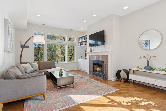 625 W Patterson Ave Unit 3E, Chicago, IL 60613 - living area with a fireplace, wood finished floors, recessed lighting, and baseboards