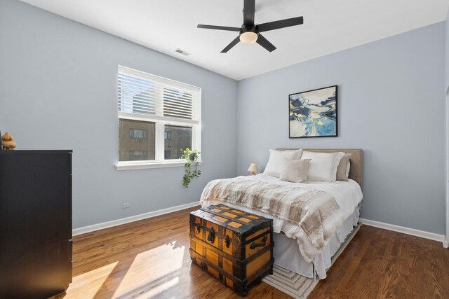 625 W Patterson Ave Unit 3E, Chicago, IL 60613 - bedroom with baseboards, wood finished floors, and ceiling fan