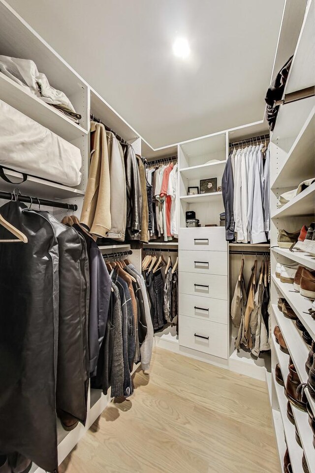 spacious closet with wood finished floors