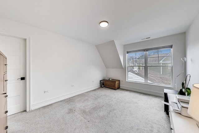 bonus room featuring baseboards, lofted ceiling, carpet flooring, and visible vents