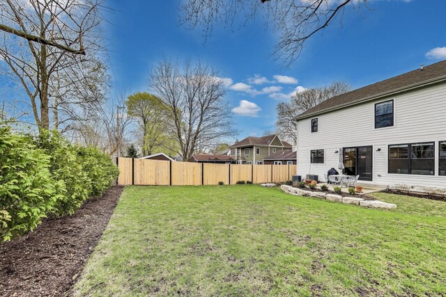 view of yard with fence and a patio area