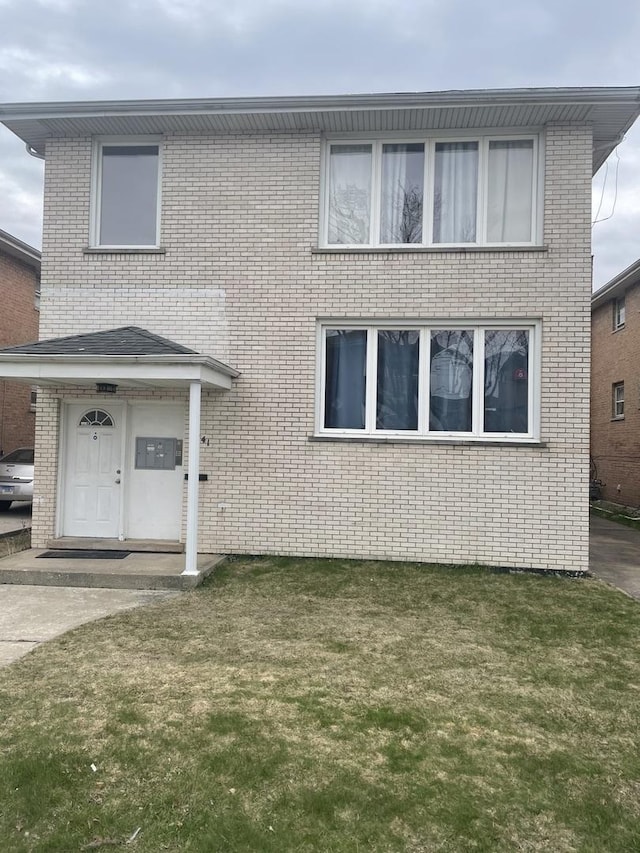 1641 Patricia Pl, Calumet City, IL 60409 - view of front facade with brick siding and a front yard