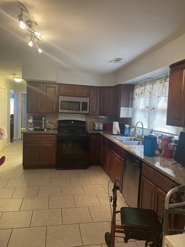 1641 Patricia Pl, Calumet City, IL 60409 - kitchen with light tile patterned floors, visible vents, a sink, stainless steel appliances, and decorative backsplash
