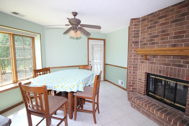 dining room with visible vents, baseboards, and a ceiling fan