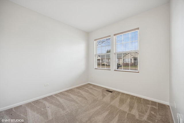 13425 Michigan Ave, Huntley, IL 60142 - carpeted empty room with visible vents and baseboards