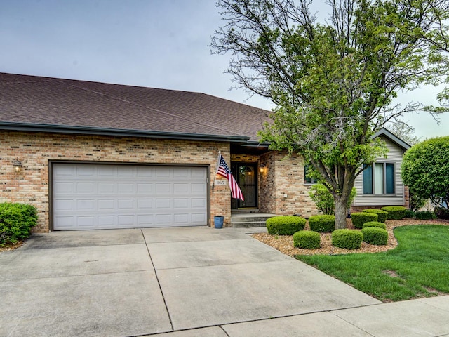 165 Fairfield Dr Unit 35B, New Lenox, IL 60451 - view of front of house with brick siding, concrete driveway, an attached garage, roof with shingles, and a front yard