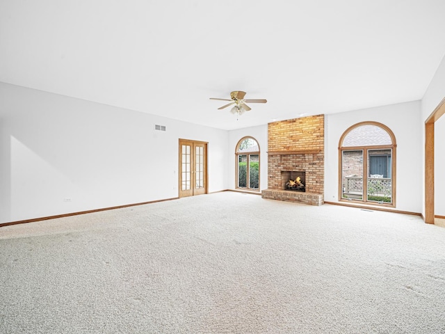 165 Fairfield Dr Unit 35B, New Lenox, IL 60451 - unfurnished living room featuring a ceiling fan, carpet floors, and baseboards