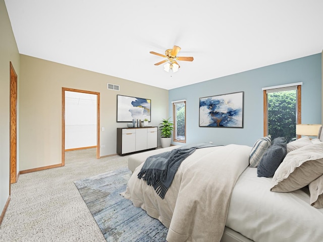 165 Fairfield Dr Unit 35B, New Lenox, IL 60451 - bedroom featuring baseboards, multiple windows, ceiling fan, and a walk in closet