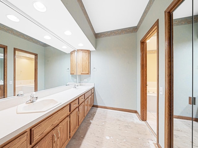 165 Fairfield Dr Unit 35B, New Lenox, IL 60451 - bathroom with a bath, baseboards, double vanity, and recessed lighting