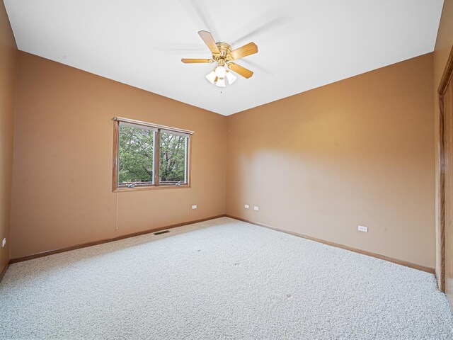 165 Fairfield Dr Unit 35B, New Lenox, IL 60451 - unfurnished room featuring baseboards, light colored carpet, and ceiling fan