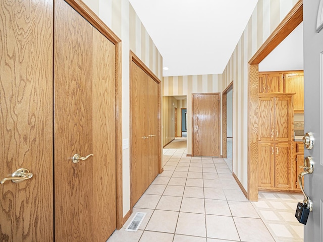 165 Fairfield Dr Unit 35B, New Lenox, IL 60451 - hallway with wallpapered walls and light tile patterned floors