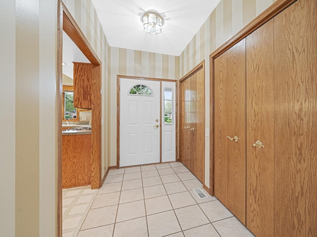 165 Fairfield Dr Unit 35B, New Lenox, IL 60451 - entrance foyer featuring wallpapered walls and light tile patterned floors
