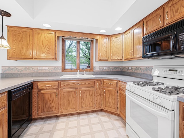 165 Fairfield Dr Unit 35B, New Lenox, IL 60451 - kitchen with black appliances, light floors, a sink, light countertops, and hanging light fixtures