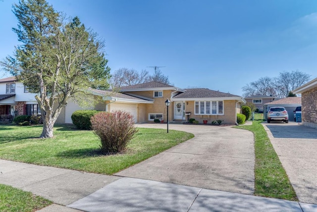 1735 W Woodland Ave, Addison, IL 60101 - tri-level home with an attached garage, driveway, and a front yard