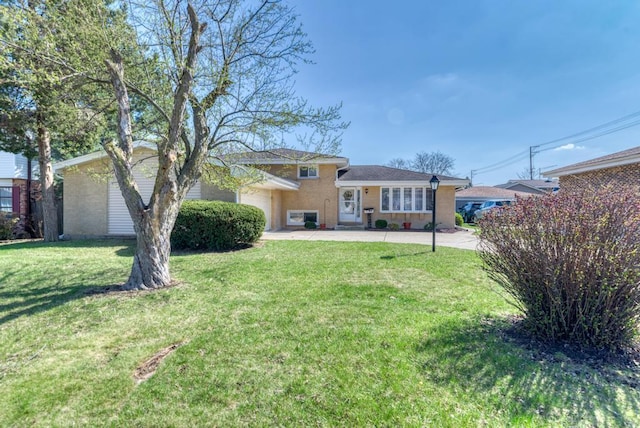 1735 W Woodland Ave, Addison, IL 60101 - view of front of property featuring a garage and a front lawn