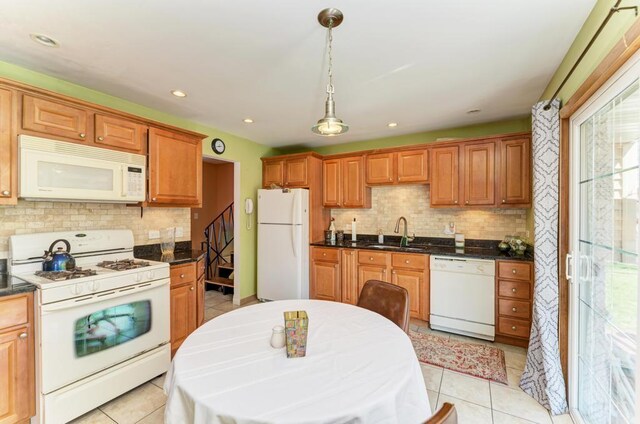 1735 W Woodland Ave, Addison, IL 60101 - kitchen featuring tasteful backsplash, white appliances, a sink, and dark countertops