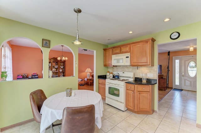 1735 W Woodland Ave, Addison, IL 60101 - kitchen with backsplash, light tile patterned floors, pendant lighting, and white appliances