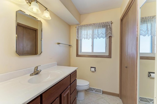1735 W Woodland Ave, Addison, IL 60101 - bathroom with plenty of natural light, visible vents, toilet, and tile patterned flooring
