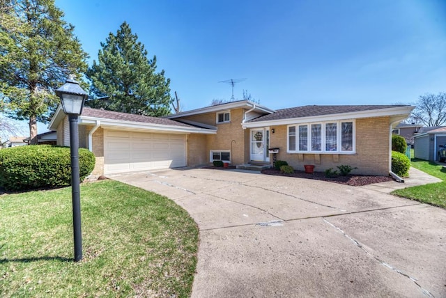 1735 W Woodland Ave, Addison, IL 60101 - split level home with brick siding, a front yard, a garage, and driveway