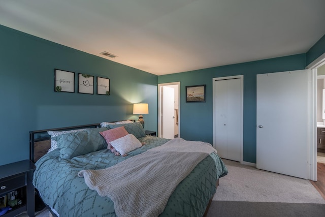 bedroom featuring carpet, visible vents, and baseboards
